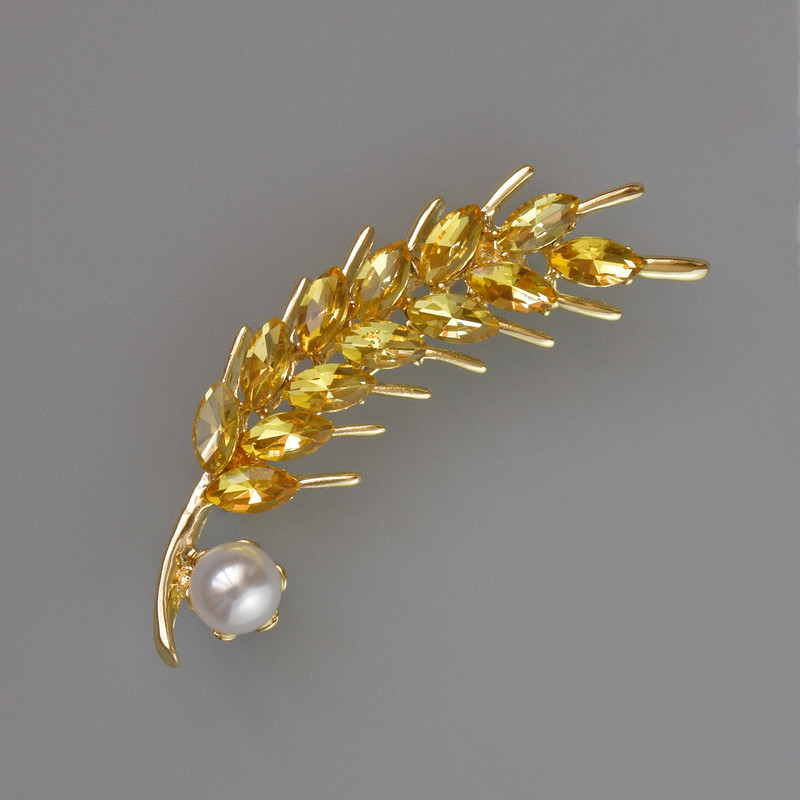 Brosche 'Ähre' mit gelben Kristallen und weißer Perle, 57 × 15 mm, goldfarbenes Metall
