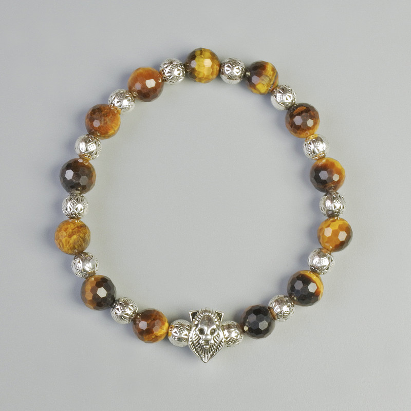 Armband aus Tigerauge, Naturstein, facettierte Kugeln Ø ca. 8 mm ± (elastisch), Länge ca. 18 cm ± mit Metall-Einsätzen