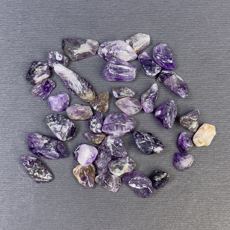 Naturstein Amethyst, bearbeitete Trommelsteine ohne Loch, 7–12×6–9 mm (±), pro 100 g