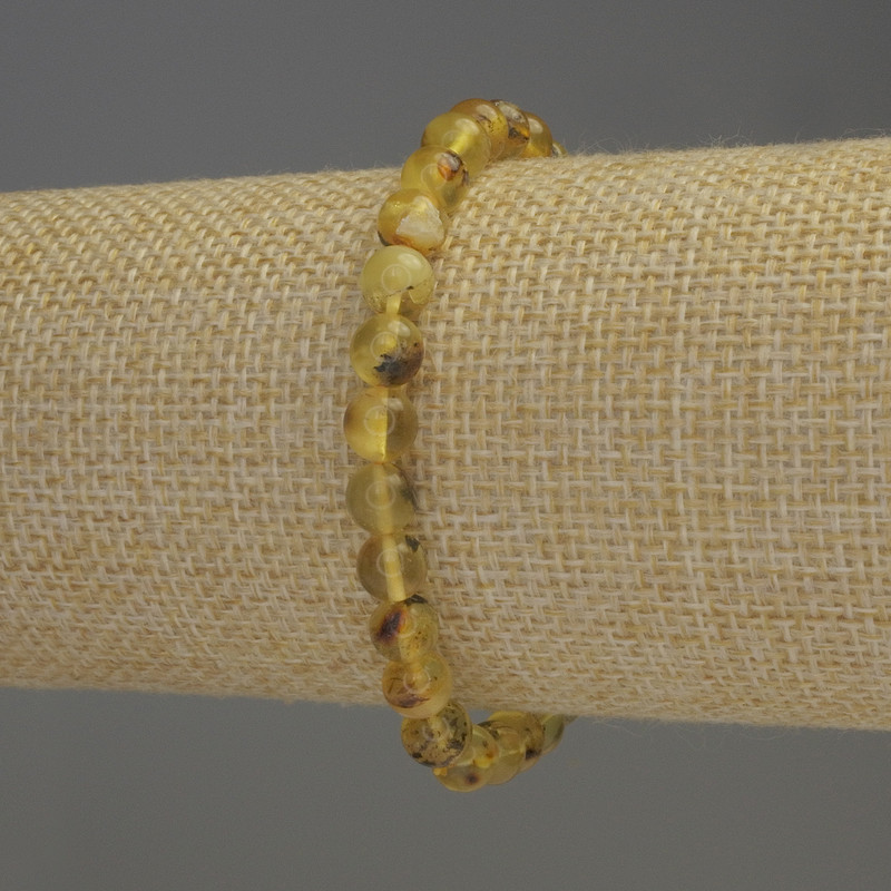 Bernsteinarmband mit glatten Kugeln, Durchmesser 6–6,5 mm, Länge ca. 18 cm, elastisches Band