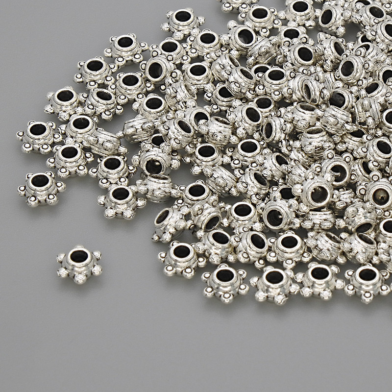 Silberfarbener Perleinsatz, Abmessungen 5×2,5 mm, Lochdurchmesser ca. 2,8 mm, Verpackung 20 g (~130 Stück)