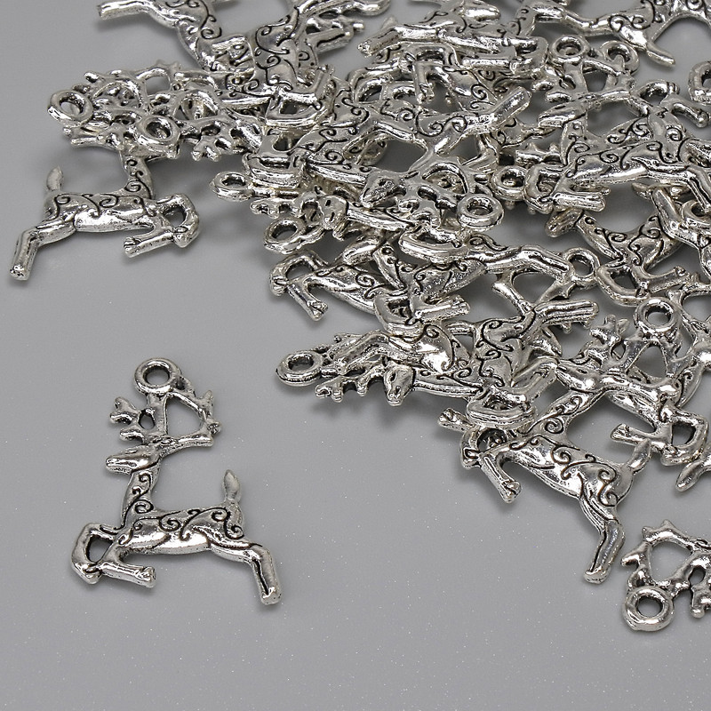 Anhänger 'Hirsch' – Metallfarbe Silber, Durchmesser 22 × 13 mm +- Loch im Öhrloch ca. 1,6 mm +- Verpackung 25 Stück+