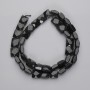Perlen Silber-Obsidian, facettiert, quadratisch, Durchmesser ca. 9–10 mm, Länge ca. 39 cm, auf Faden