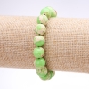 Armband aus Varizit (gepresst) Salatgrün, glatte Kugeln, Durchmesser 10 mm, Länge 18 cm, auf Gummiband