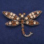 Brosche Libelle mit gelben Kristallen und goldfarbenem Metall, 45×74 mm