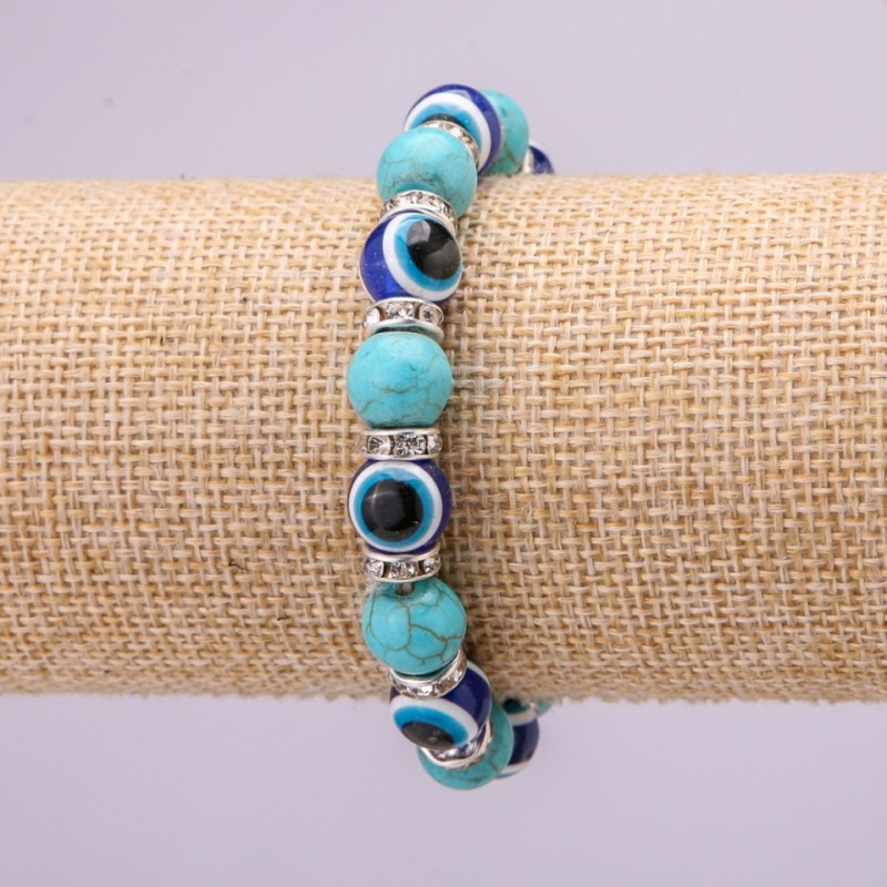 Schutzarmband aus Türkis mit blauen Augen auf elastischem Gummiband, Durchmesser ca. 10 mm, Länge 18 cm, mit Einsätzen und Strasssteinen