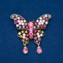 Brosche 'Schmetterling' aus goldfarbenem Metall, mehrfarbige Strasssteine, 48 × 60 mm +