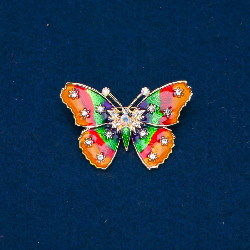 Brosche Schmetterling goldfarben mit Emaille und Strasssteinen