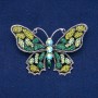 Brosche Schmetterling aus silberfarbenem Metall, grüne, limettenfarbene und petrolfarbene Strasssteine, 48 × 71 mm
