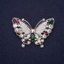 Brosche Schmetterling mit Strasssteinen, Farben: Himbeerrot, Weiß, Grün und Gelb, 40×58 mm, silberfarbenes Metall