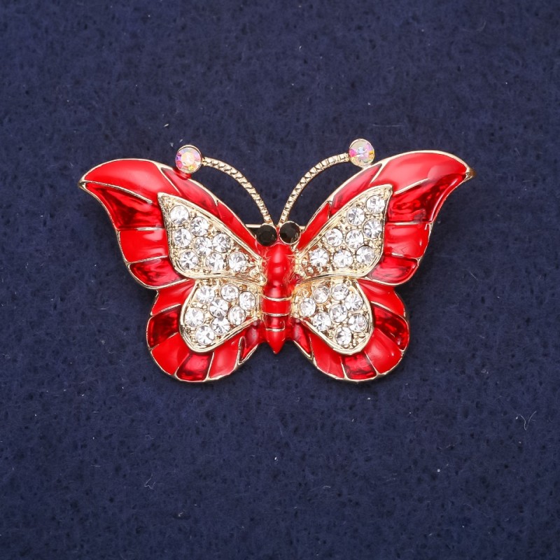 Brosche Schmetterling mit roter Emaille, weißen Strasssteinen, 45×28 mm, gelbgoldfarbenes Metall