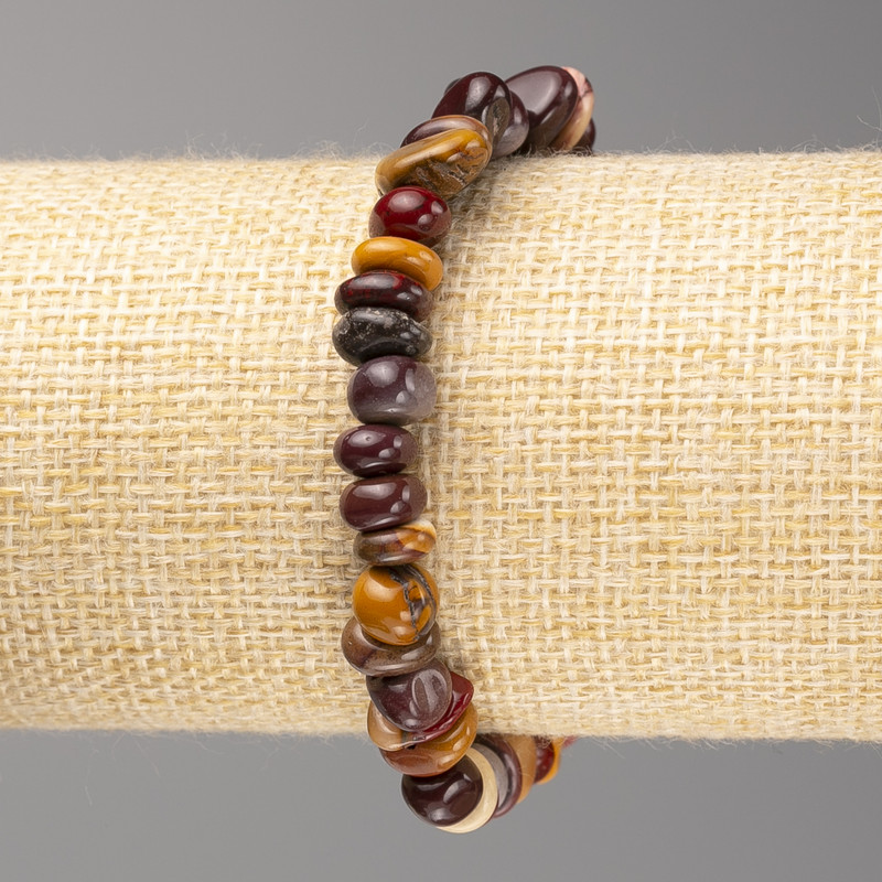 Armband aus Mookait-Jaspis, facettierte Perlen, Durchmesser ca. 6 x 9 mm, auf Elastikband, Länge ca. 18 cm+