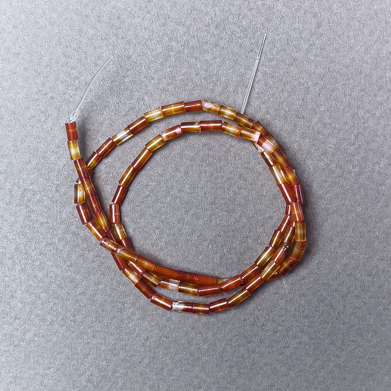 Karneol-Perlen, Naturstein, facettiert, Durchmesser 2×5 mm, Länge ca. 38 cm, auf Faden