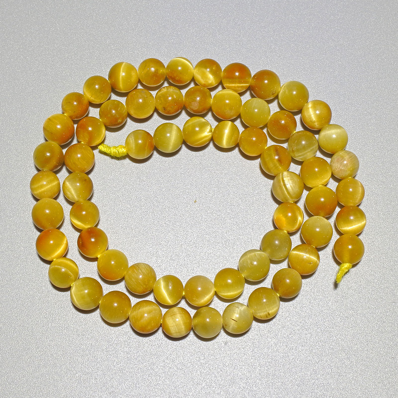 Gelbe Katzenauge-Perlen aus Naturstein – glatte Kugeln, Durchmesser 6,5 mm, Länge ca. 38 cm, auf einer Schnur