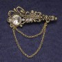 Brosche Akzent mit weißen Strasssteinen und Kristall, goldfarbenes Metall 55×22 mm
